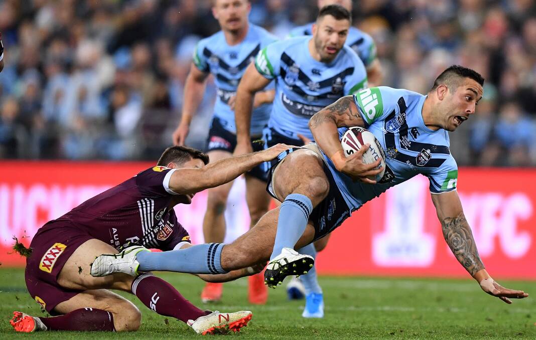 Charge: Paul Vaughan on the attack for the Blues during the State of Origin series decider on Wednesday. Picture: AAP Image/Joel Carrett