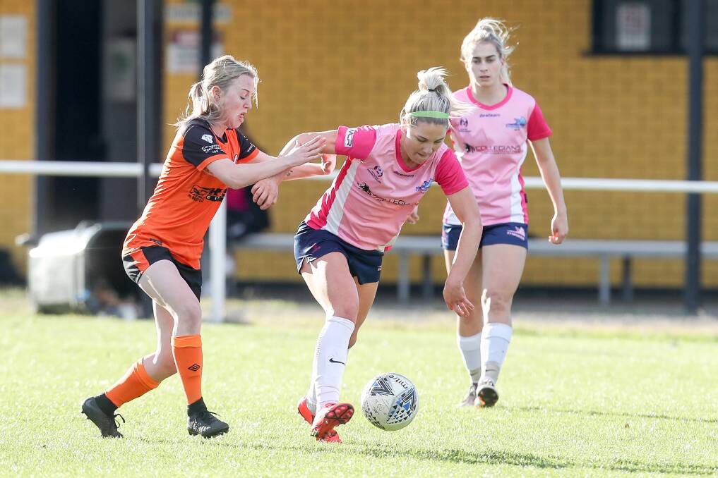 High five: Former Matildas defender Caitlin Cooper played a key role in the Stingrays win. Picture: Adam McLean.