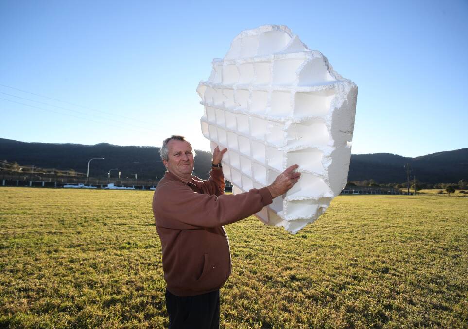 Clean up needed: A Wongawilli farmer's son, John Nobbs, wants Wollongong City Council to help clean up polystyrene used in building slabs that blew onto his father's farm. Picture: Robert Peet