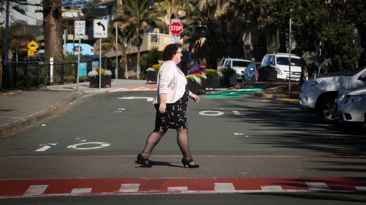 Wollongong Councillor Tania Brown walking across the pedestrian crossing outside the Novotel Northbeach. Picture: Adam McLean.