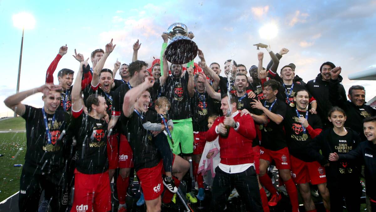 Drought breakers: Luke Wilkshire and the Wollongong Wolves celebrate their NSW NPL premiership. Picture: Sylvia Liber.