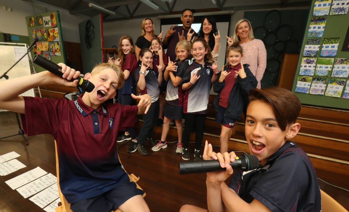 Gerringong Public School students Riley Dwyer and Sam Le with other participants taking part in the Song Playground program. Pictures: Robert Peet