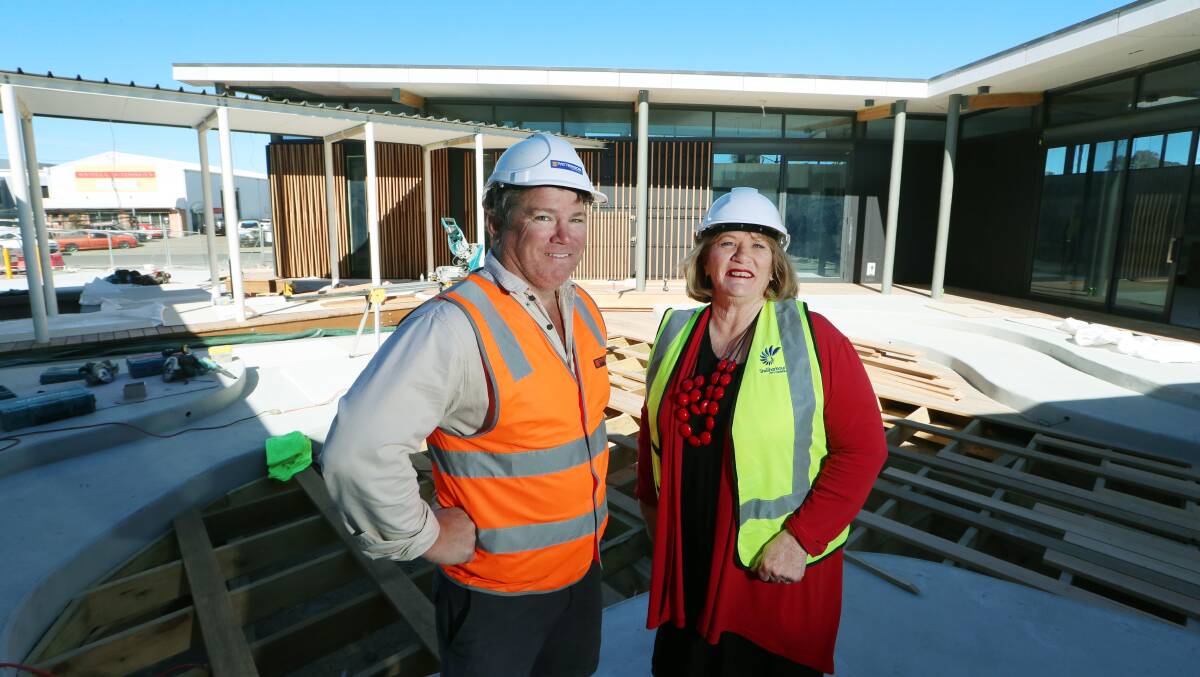 ON TRACK: Site manager Greg Kahler and Shellharbour Mayor Marianne Saliba inspect work on the Warilla Library. Picture: Sylvia Liber.