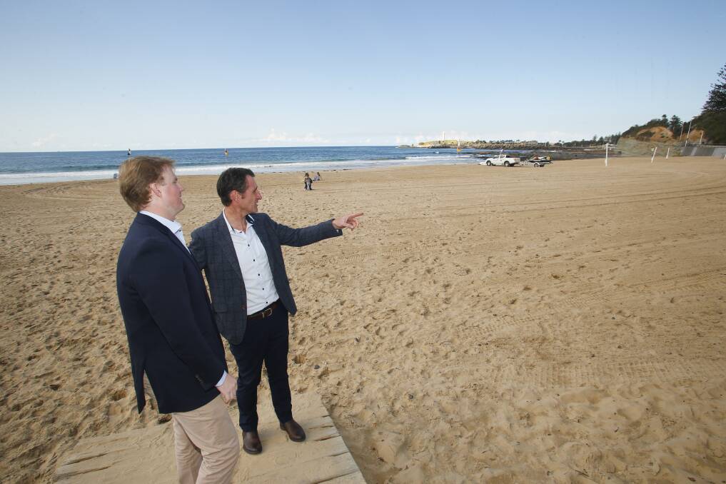 LINE IN THE SAND: Cameron Walters and Jeremy Wilshire discuss a plan to trial a beach club on North Wollongong Beach. Picture: Anna Warr