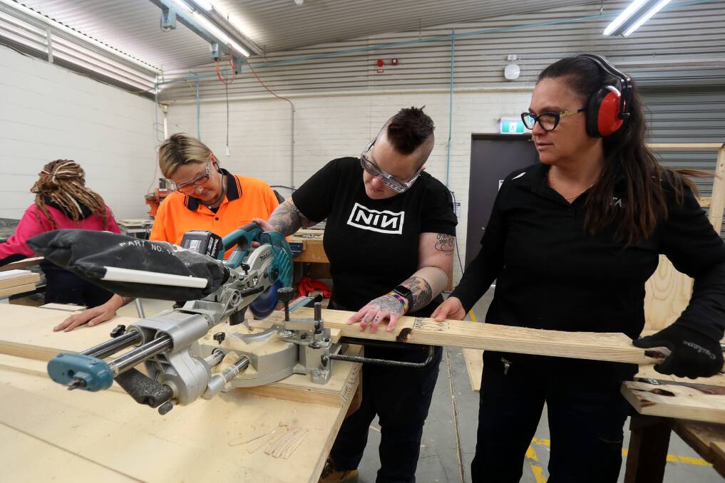 HANDY WOMEN: TAFE Wollongong students Rebecca Johnston and Krystina Semmler with SALT vice-president Flavia Teixeira. The trio are taking part in a pilot program. Picture: Robert Peet