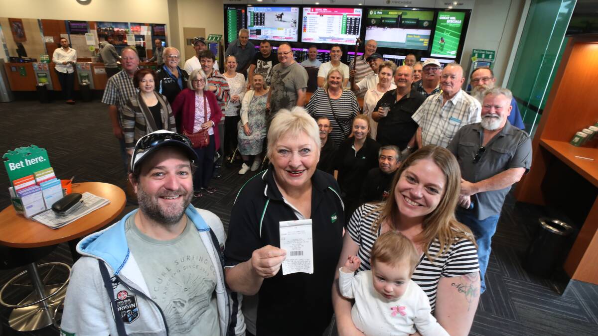 Chance: Alan, Kelly and Charlise Montgomery with Shellharbour TAB's Christine Tolhurst (centre) and the punters club. Picture: Robert Peet