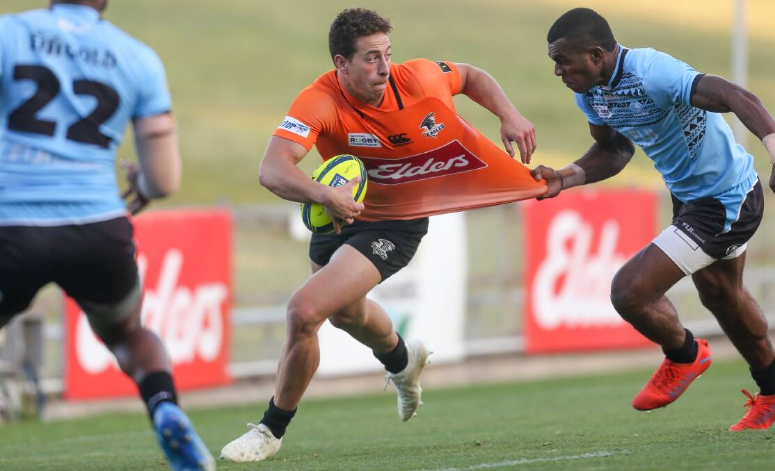 Run down: NSW Country's Jake Gordon is tackled during Saturday's draw at WIN Stadium. Picture: Adam McLean.