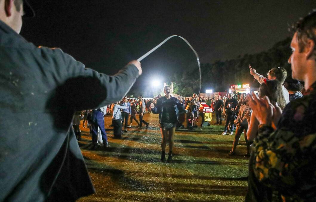 Revelers passed the time between sets with a game of jump rope.