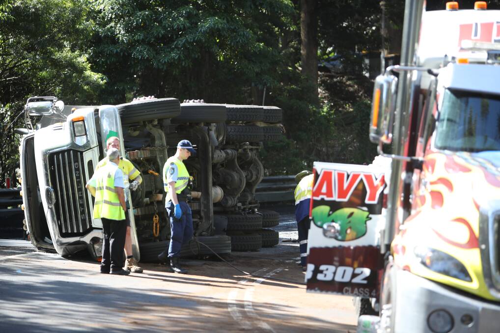 Vital road: Traffic in Stanwell Park was brought to a standstill for hours after a 19-year-old P-plater flipped his truck along Lawrence Hargrave Drive on Tuesday afternoon. Picture: Adam McLean.