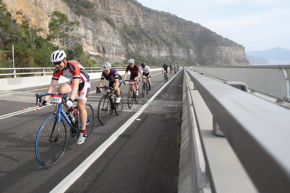 Ride: Cyclists cross the Sea Cliff Bridge during the Sydney to Gong bike ride, one event that has linked the city with cycling. Picture: Adam McLean.