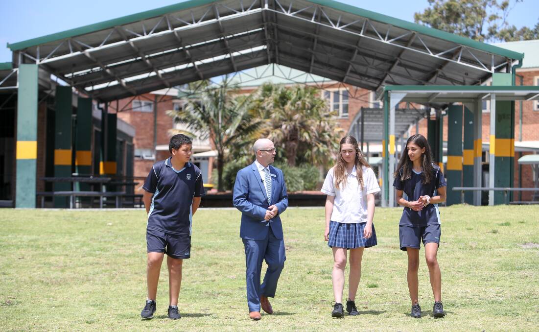 NEXT STEP: Corrimal High School principal Paul Roger pictured with students Ngakau Jenner, Chiahni Zulian and Suzanne Abou Shalah in 2019, marking the one-year anniversary of November 3, 2018 fire. Picture: Adam McLean.