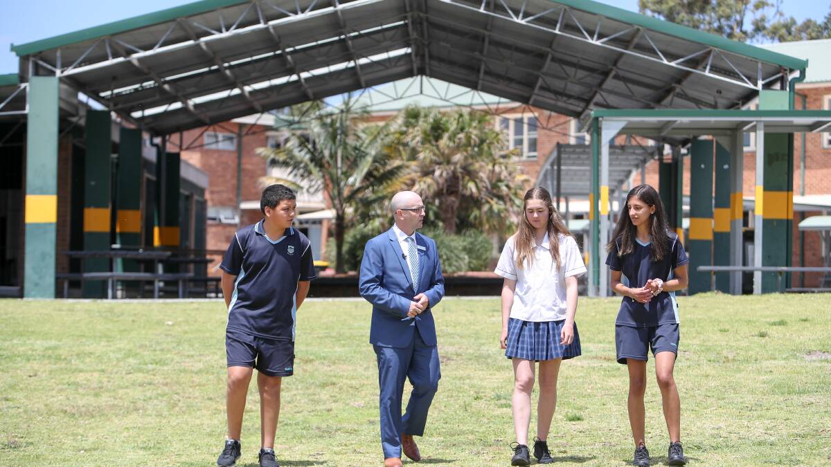 TAKING A STROLL: Corrimal High principal Paul Roger with students Ngakau Jenner, Chiahni Zulian and Suzanne Abou Shalah. Picture: Adam McLean.