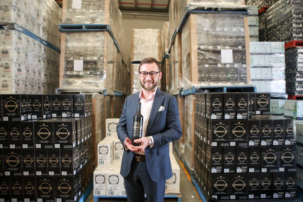 Kollaras Group managing director John Kollaras with cartons of Mogul - a wine brand they developed specifically for the Chinese market. Picture: Adam McLean.