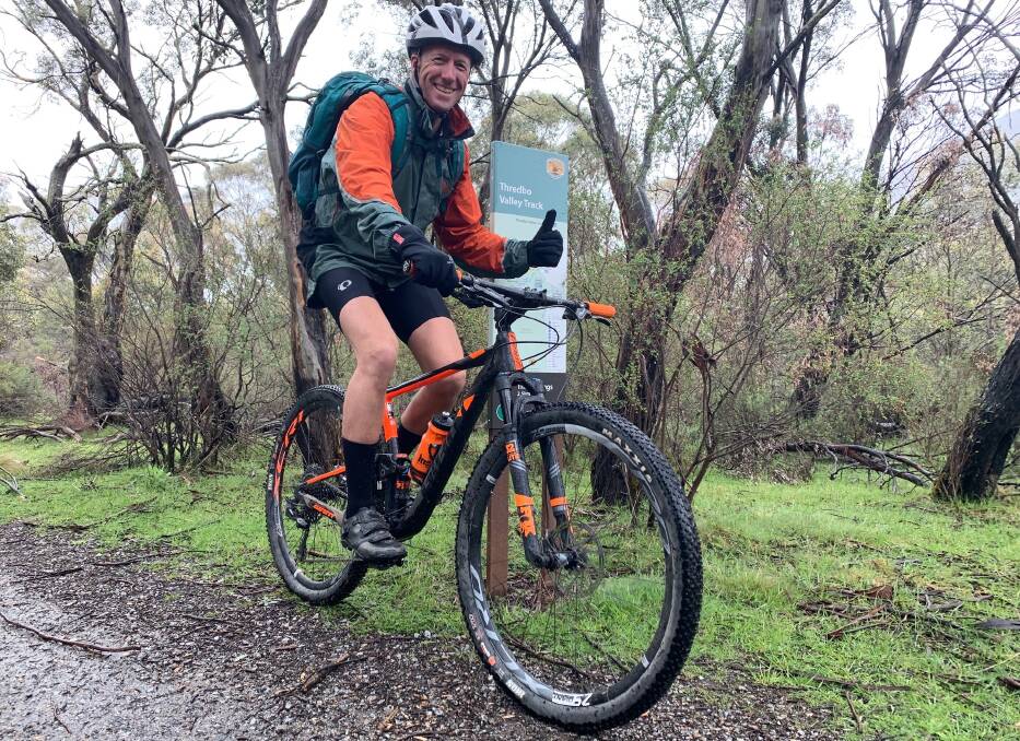 Experienced cross-country mountain biker, Daniel Smith of Queanbeyan, gives the extension of the Thredbo Valley Track the thumbs-up. Picture: Tim the Yowie Man