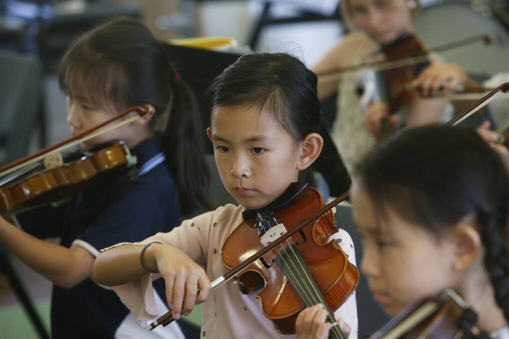 Lleywellyn Strings member Yuehan Zhau, 8, on violin. Picture: Anna Warr.