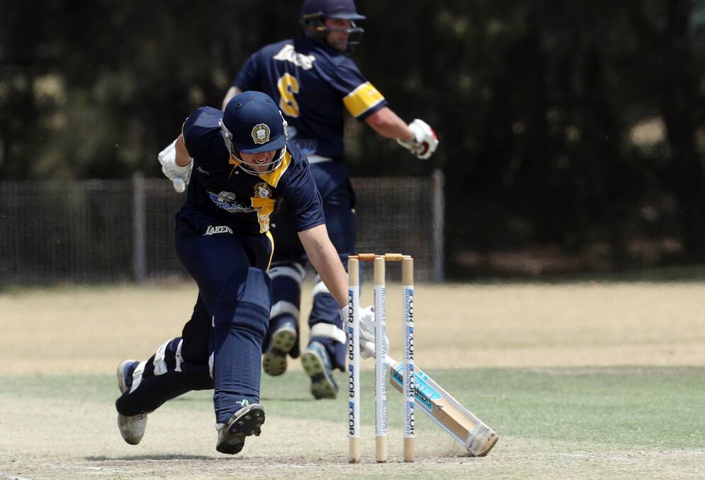 Make your ground: Lake Illawarra's Ryan Maguire slides the bat chasing quick runs in the victory over Shellharbour. Picture: Robert Peet