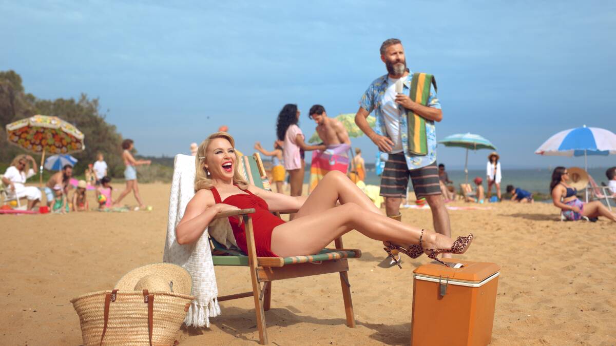 Kylie Minogue and Adam Hills in Sandringham, Victoria as part of the Come Live Our Philausophy campaign. Picture: Tourism Australia