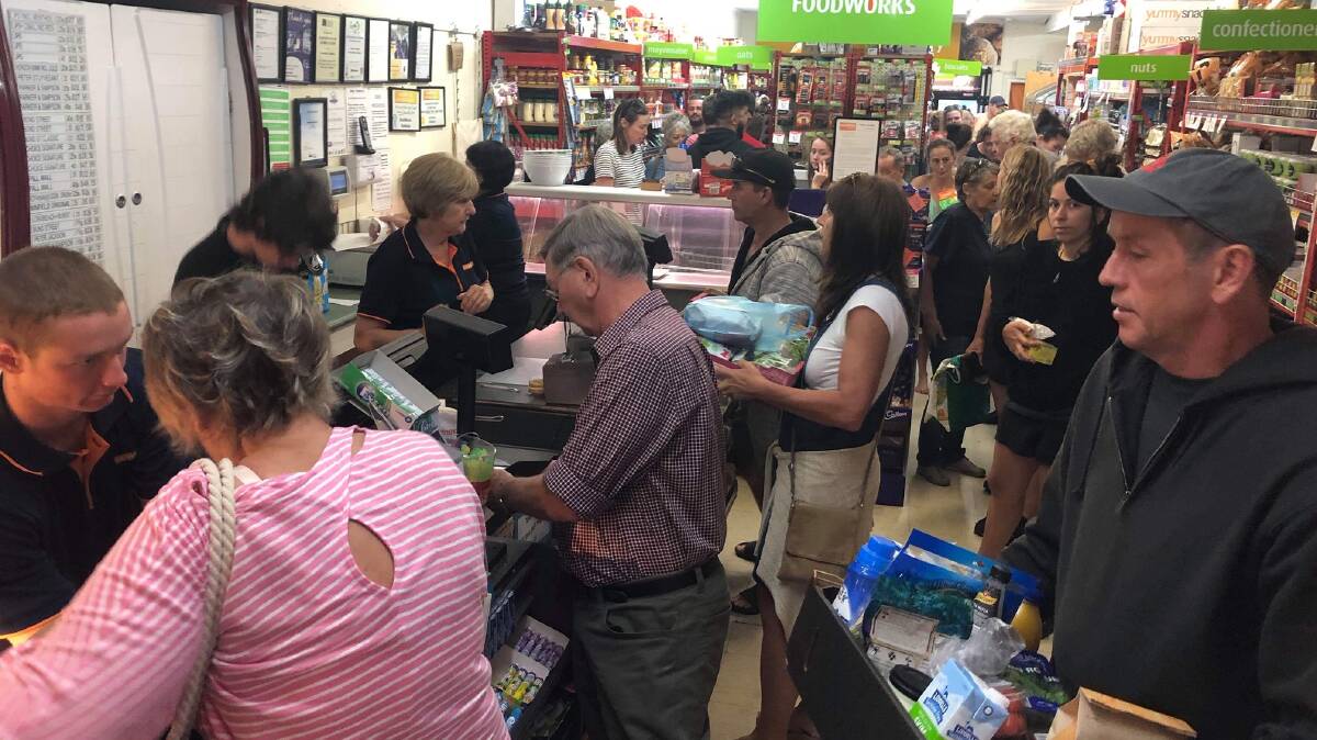 People flooded the supermarket in Pambula to stock up on supplies as the fire threatened. Picture: Kimberley Le Lievre