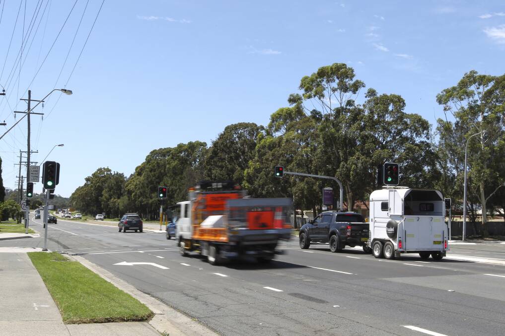 Stop: A new set of traffic lights along the Princes Highway at Albion Park were switched on last Friday. Picture: Anna Warr