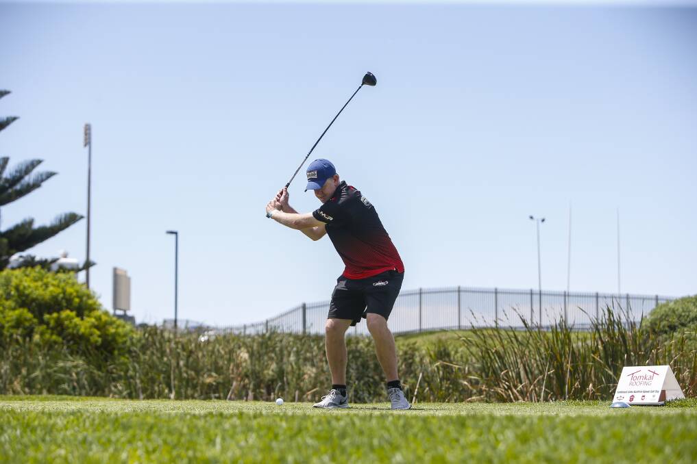 IN THE SWING OF IT: Hawks coach Matt Flinn tees off at Monday's Illawarra Codes Combined Charity Golf Day. Picture: Anna Warr