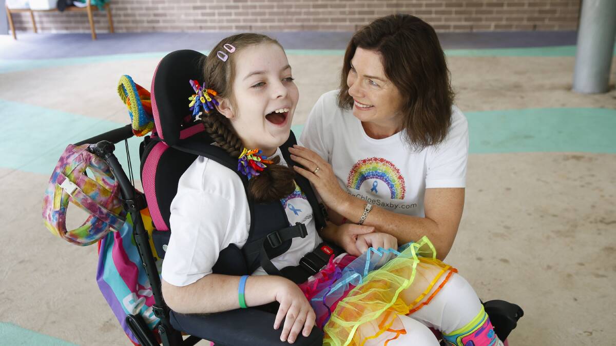MERC, NEWS, CHLOE SAXBY Pic taken Thursday February 27. 2020. Woonona East Public School students will again raise awareness of Rare Disease Day, and support their fellow student Chloe Saxby by fundraising for Saving Chloe Saxby. Chloe and her mother Nyree Saxby. Picture: Anna Warr