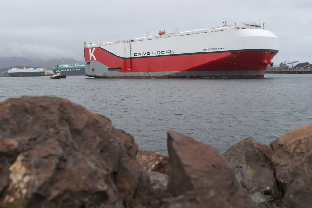 Quarantine: The Japanese-owned ship Drive Green Highway leaving Port Kembla on Wednesday - an ill crew member had been placed in isolation and rushed to Wollongong Hospital. Picture: Adam McLean.