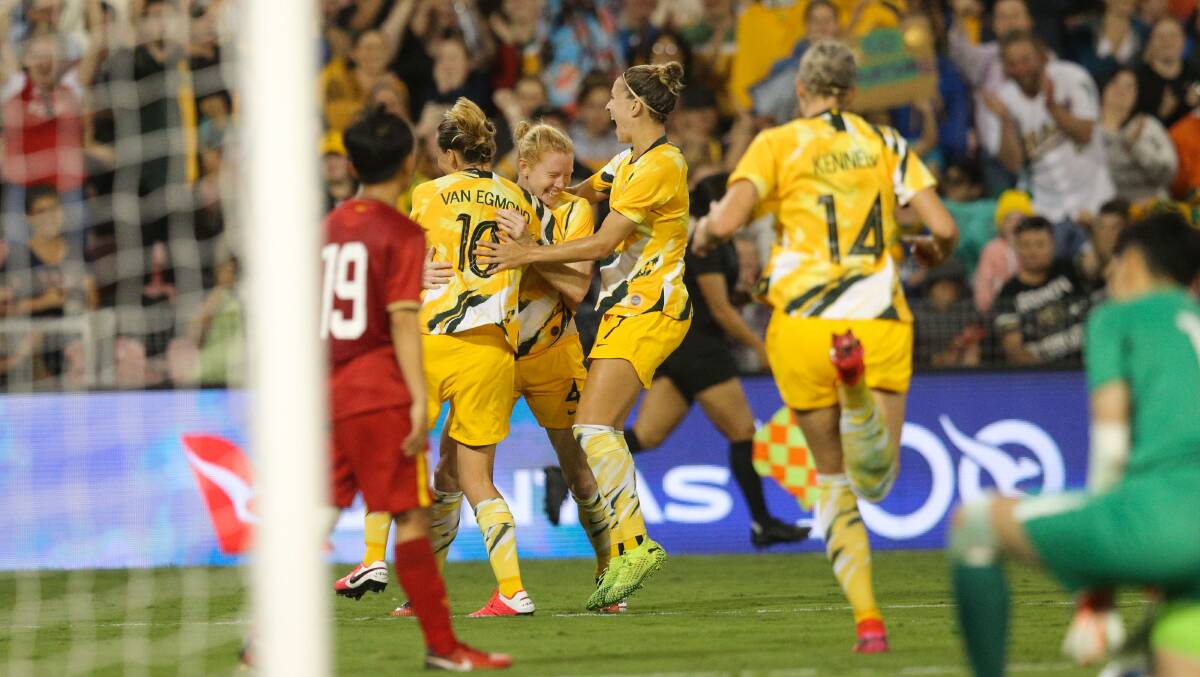 Green and bold: Clare Polkinghorne celebrates with Matildas teammates during the win over Newcastle on Friday. Picture: Max Mason-Hubers
