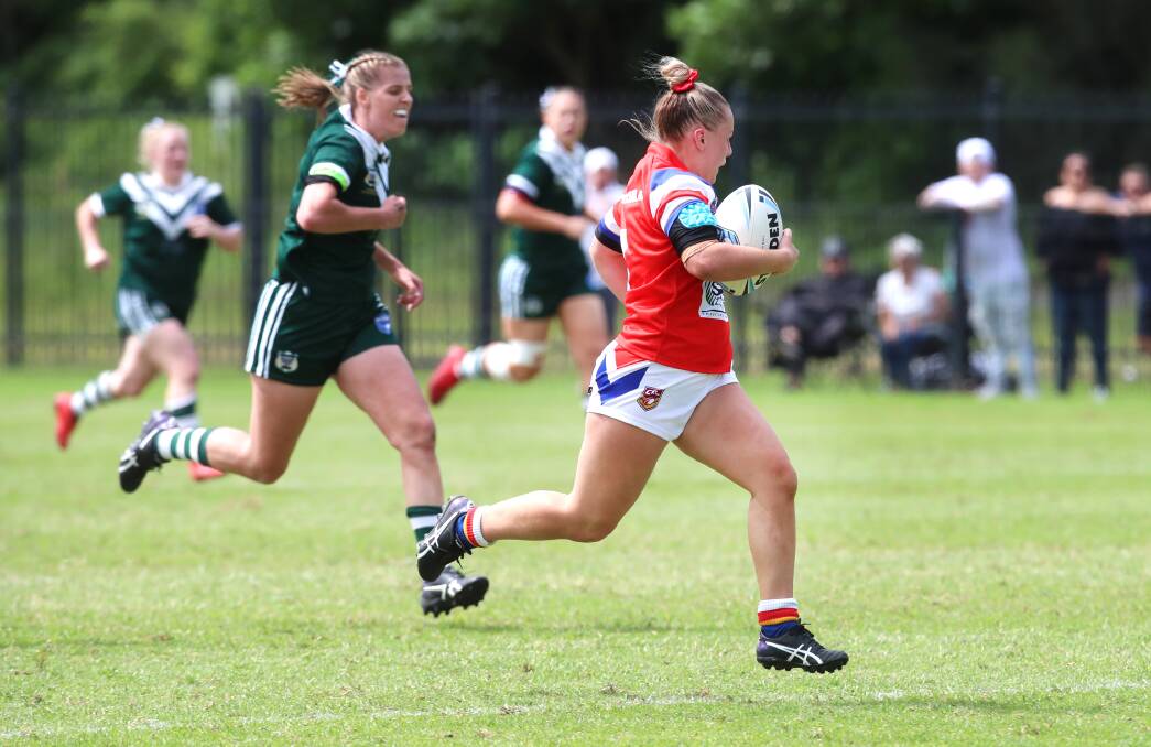 OFF: Brittany Constable en route to her 80-metre try on Sunday. Picture: Sylvia Liber