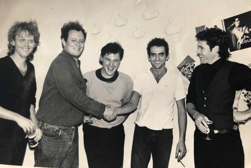 Memories: Paul Kelly (second from right) at the 1986 launch of his double album Gossip, with manager Stuart Coupe (far left).