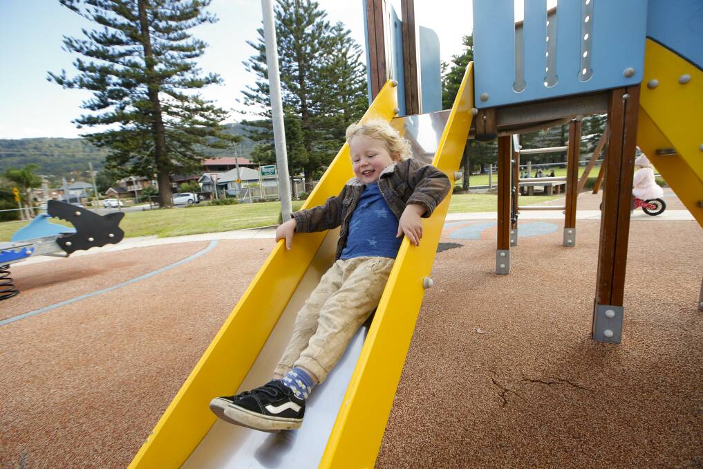 Three-year-old Bodhi Lancaster enjoying a playground at Thirroul on Friday, the first day of coronavirus restrictions being eased. Picture: Anna Warr