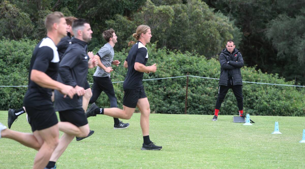 Back on the paddock: Wolves coach Luke Wilkshire watches on as his players train. Picture: Robert Peet