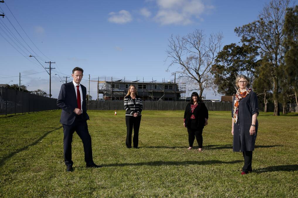 Off-target: Labor MPs Stephen Jones, Sharon Bird with Southern Youth and Family Services CEO Narelle Clay and The Housing Trust's Michelle Adair on land that's ready for a public housing project. Picture: Anna Warr