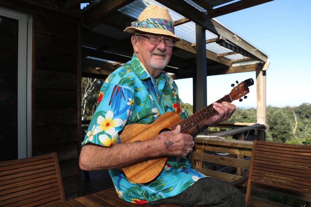 MUSIC MAN: Mick Berghuis from Woonona playing his beloved ukulele. He is being honoured with an OAM for service to the community through music. Picture: Robert Peet