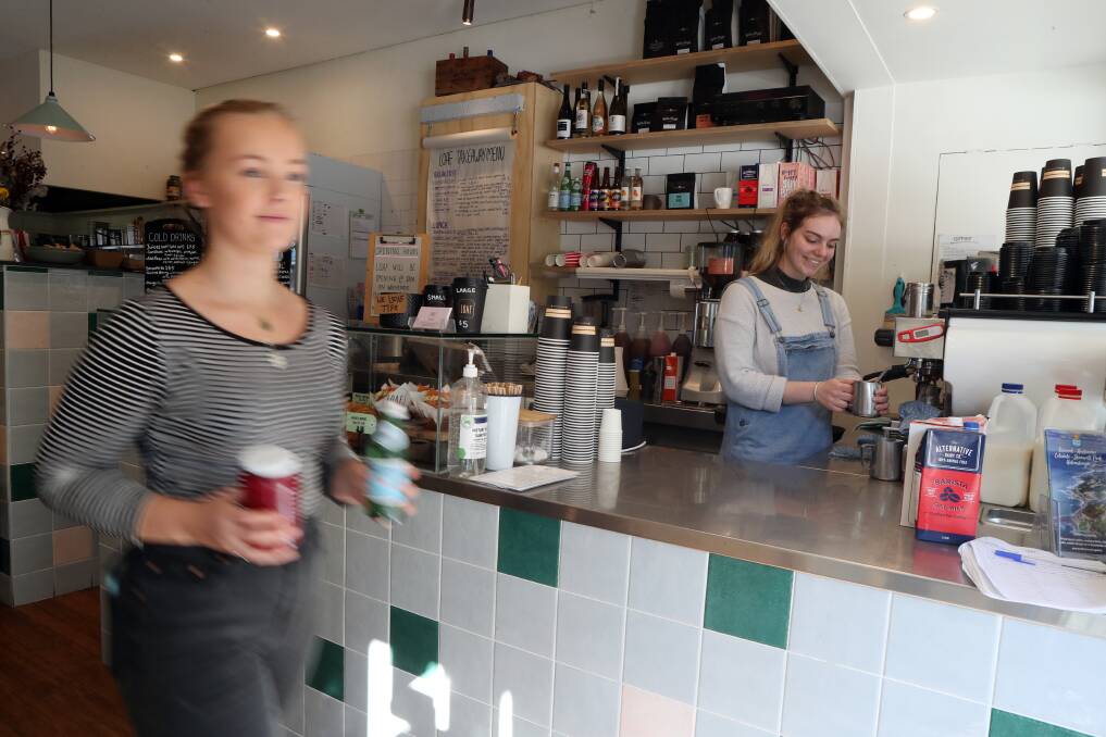 Tamara Lilliendal and Ashley Petersen working at Stanwell Park';s Loaf Kitchen ... owner Annaleigh Sturmann said business has dropped substantially since the road closure. Picture: Robert Peet