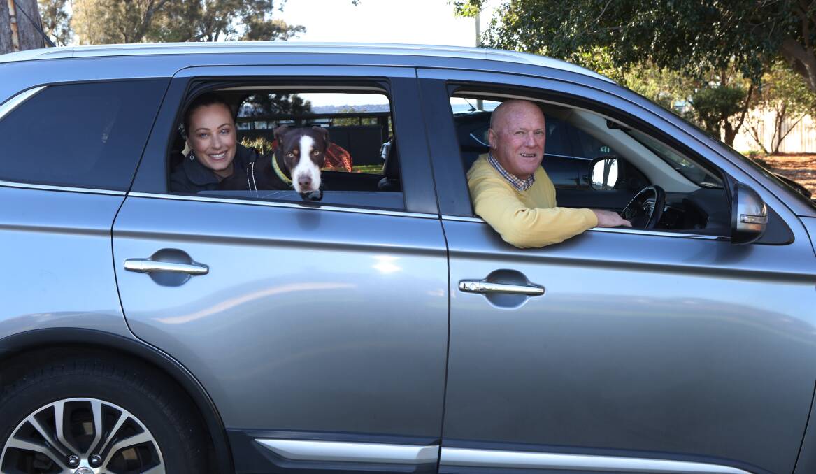 Pet-friendly: Erin Condran and Toby take a ride with Uber driver Greg DeCelis - the rideshare company now has a pet service. Picture: Robert Peet