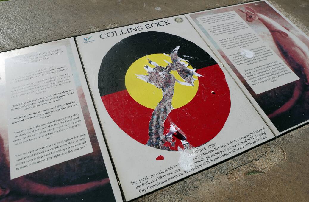 HISTORY WARS: While the Aboriginal flag stickers were removed from other plaques, attempts on this one were not successful. Picture: Robert Peet.