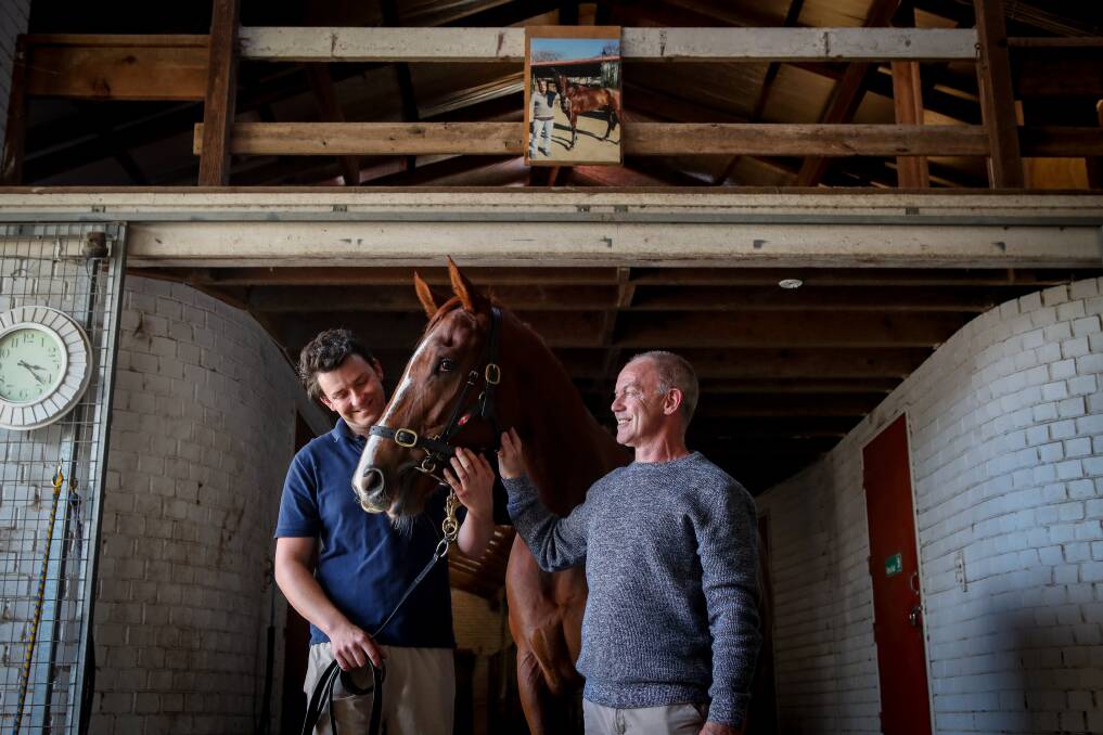 Slow build: Brett Lazzarini (right) with son Wyatt and horse Lamelo. Picture: Adam McLean.