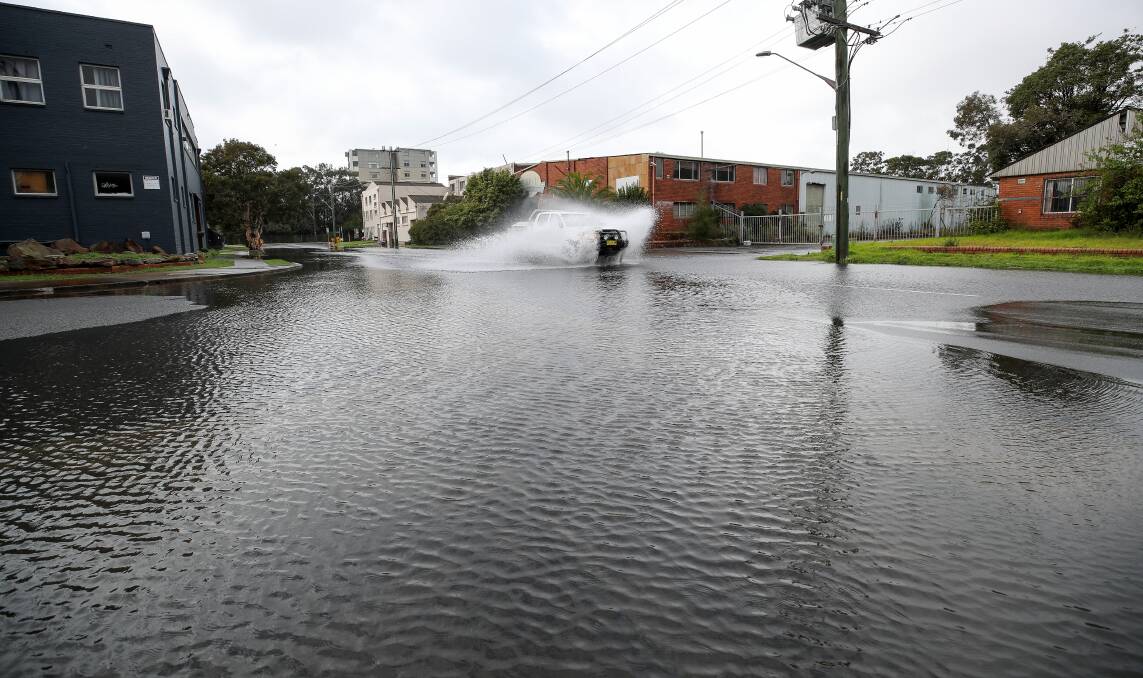Driving: Beatson and Beach streets in Wollongong, not far from the CBD, were underwater. Picture:Adam McLean