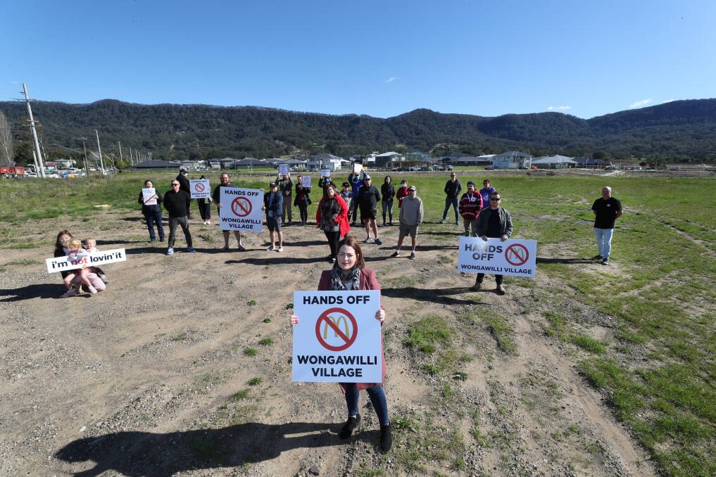 Burger off: Wongawilli resident Natasha Panetta with other concerned residents at the site of a proposed 24-hour McDonald's and service station at Wongawilli on Monday. Picture: Robert Peet