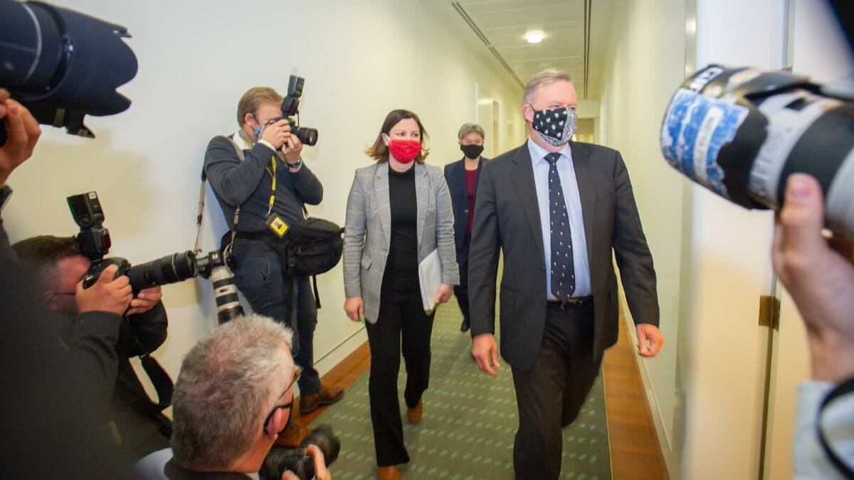 Kristy McBain and Anthony Albanese arrive fully masked for a Labor caucus meeting. Picture: Karleen Minney