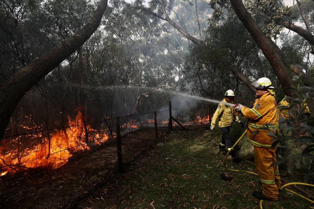 RFS and Fire and Rescue NSW crews performing a hazard reduction burn at bushland near Bendena Gardens in Stanwell Tops in September. Picture: Adam McLean