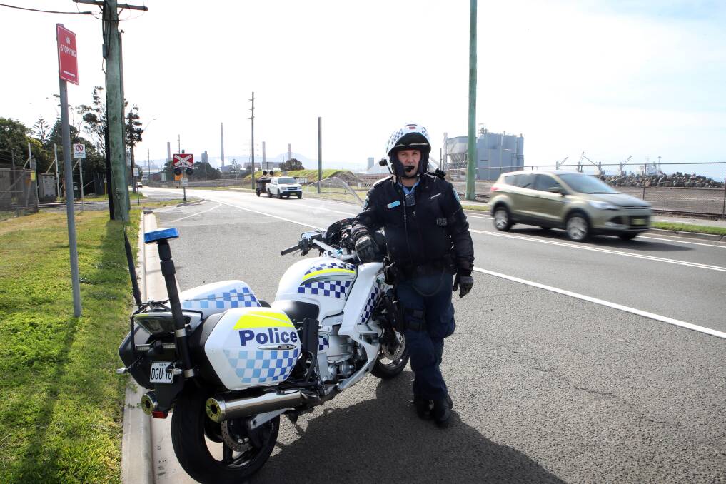 Focus: Traffic and Highway Patrol Acting Sergeant Chris Troman at the Old Port Road level crossing, target of a police operation. Picture: Sylvia Liber