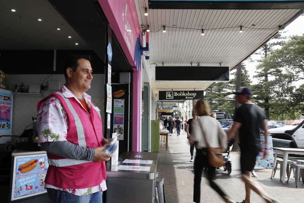 Anthony Varayiannis of Scoops Ice-Creamery in Kiama ensure customers sanitise before entering his family's cafe. Picture: Anna Warr