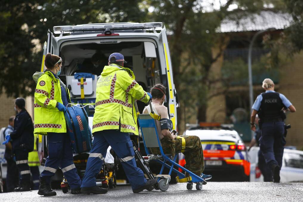 Ambulance crews take a stabbing victim from an apartment block in Johansen Way, Mangerton. Picture: Anna Warr