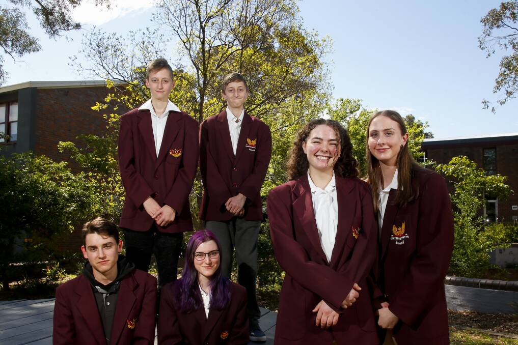 SEEING DOUBLE: Three sets of twins at Dapto High School are doing their HSC this year. They are (top) Alex and Nicholas Kakais, Joshua and Caitlyn Slade as well as (standing) Isabelle and Jacinta Madden. Picture: Anna Warr