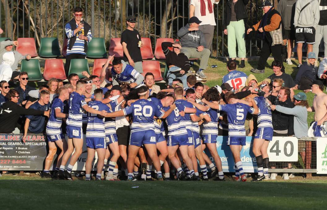 NEW DAY: Thirroul celebrates its Open Age side's grand final victory last weekend. Picture: Robert Peet