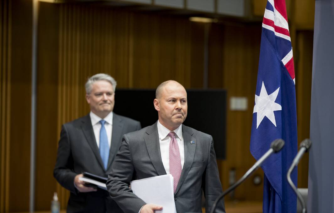 BOYS' NIGHT OUT: Finance minister Mathias Cormann and Treasurer Josh Frydenberg at a media briefing on the 2020-21 Federal Budget at Parliament House. Picture: Sitthixay Ditthavong