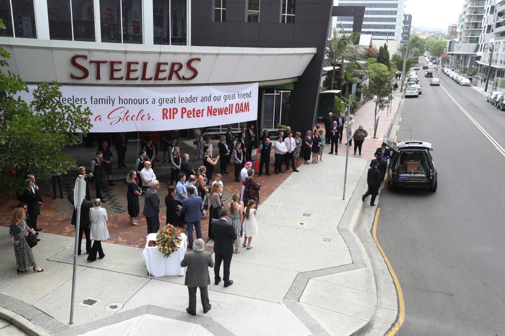 Legend: The hearse carrying Peter Newell drove by his beloved Steelers Club after the service to farewell the much-loved newspaperman and Steelers stalwart. Picture: Robert Peet