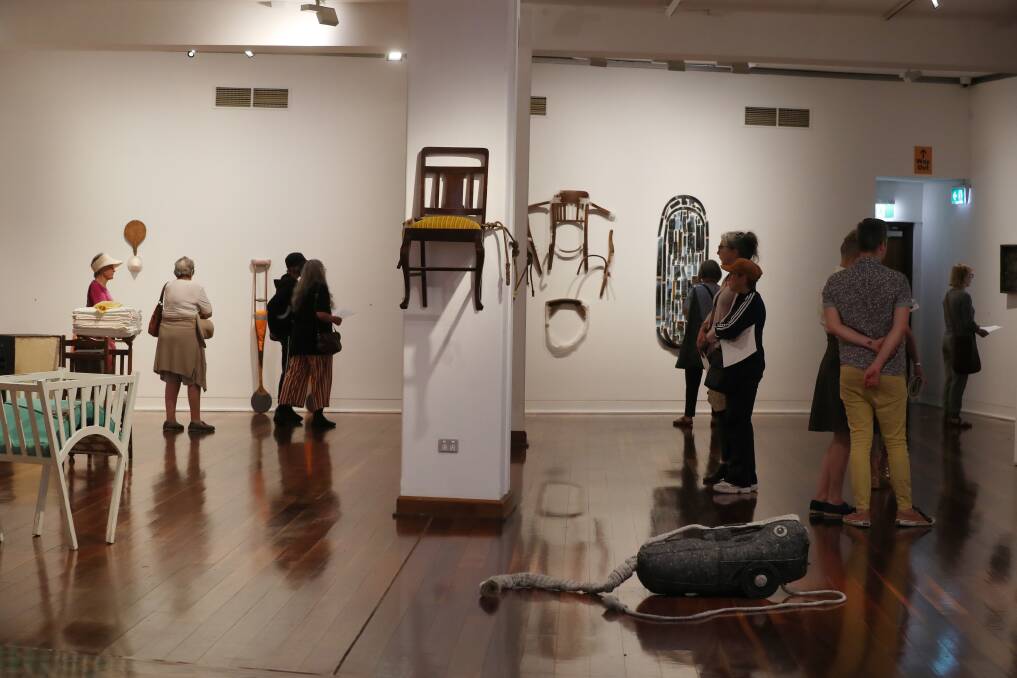 People enjoying Anita Johnson Larkin's exhibition at the Wollongong Art Gallery on Sunday. Picture: Robert Peet