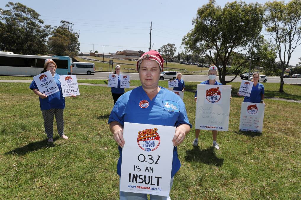 OFFENSIVE: NSWNMA Shellharbour Hospital branch secretary Amanda Wells out front of the socially distanced protest over the State Government's near-wage freeze. Picture: Robert Peet.